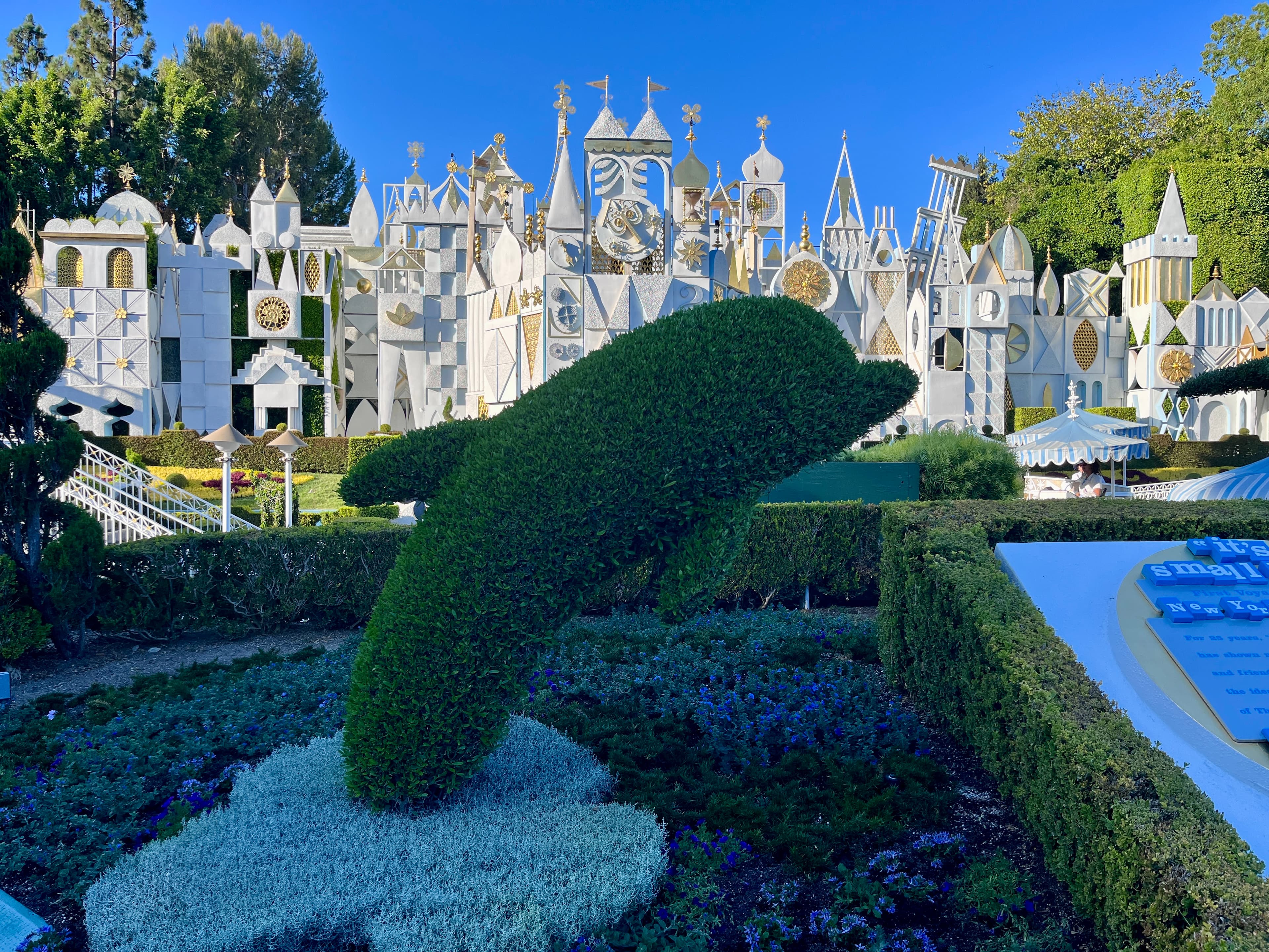 Small World and a topiary at Disneyland on a sunny day